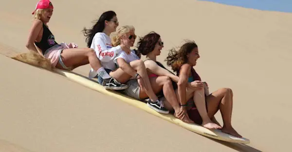 Sandboarding in the Sahara – panoramic dune view